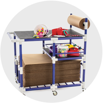 Blue cart with cardboard, paper roll, and other makerspace components